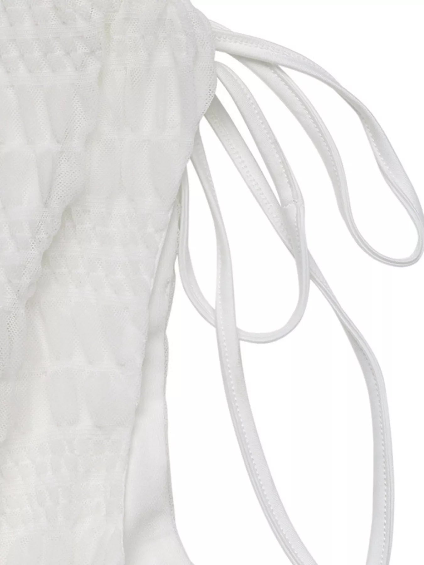 Close-up of white shoelaces on a white background