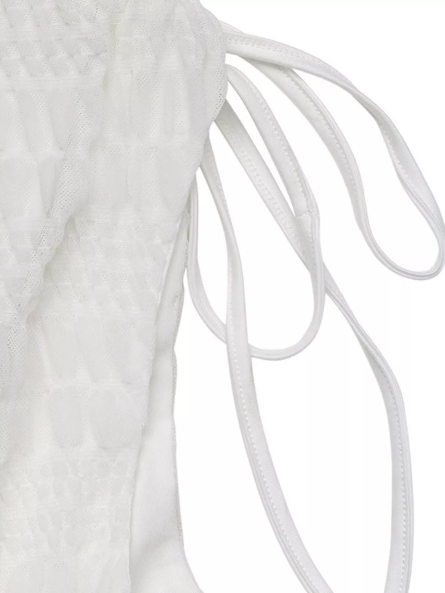Close-up of white shoelaces on a white background