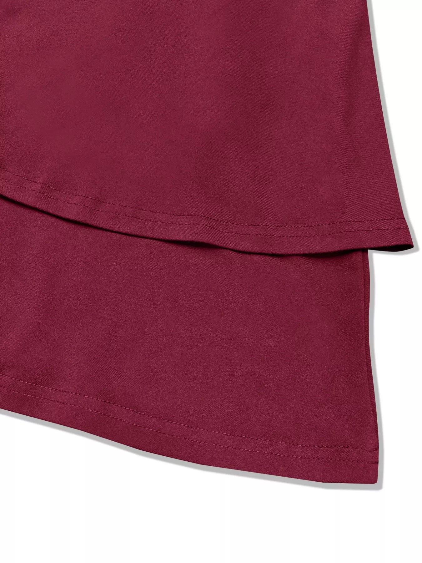 Close-up of a maroon fabric with a white background