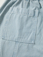 Close-up of a blue and white striped shirt with a pocket