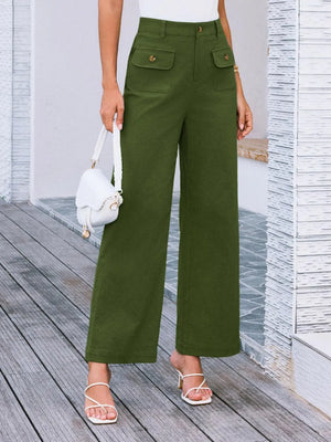 Person wearing green wide-leg pants with a white background
