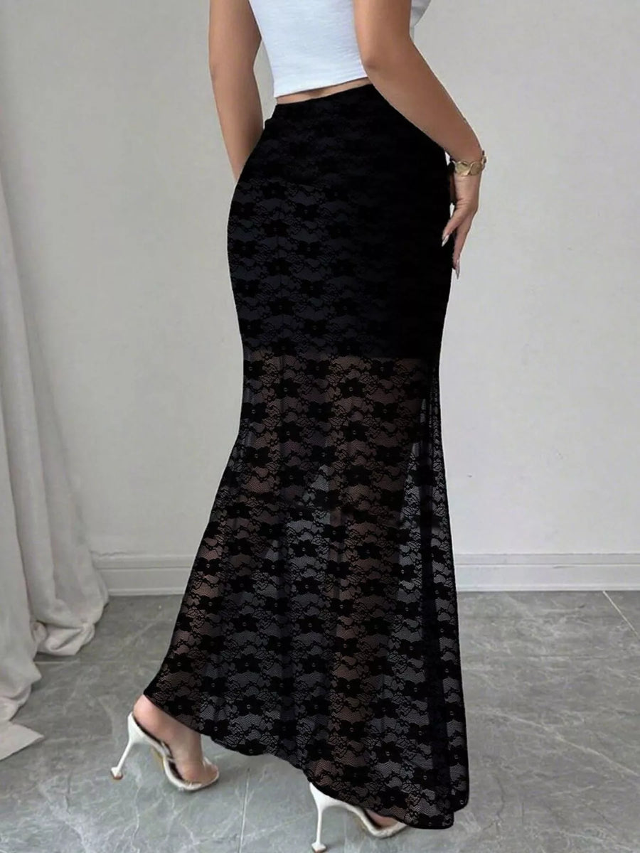 Black lace skirt worn by a person on a neutral background