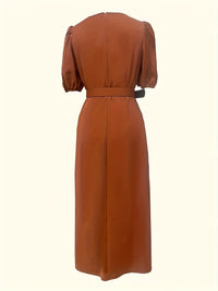 Brown dress with puff sleeves on a white background