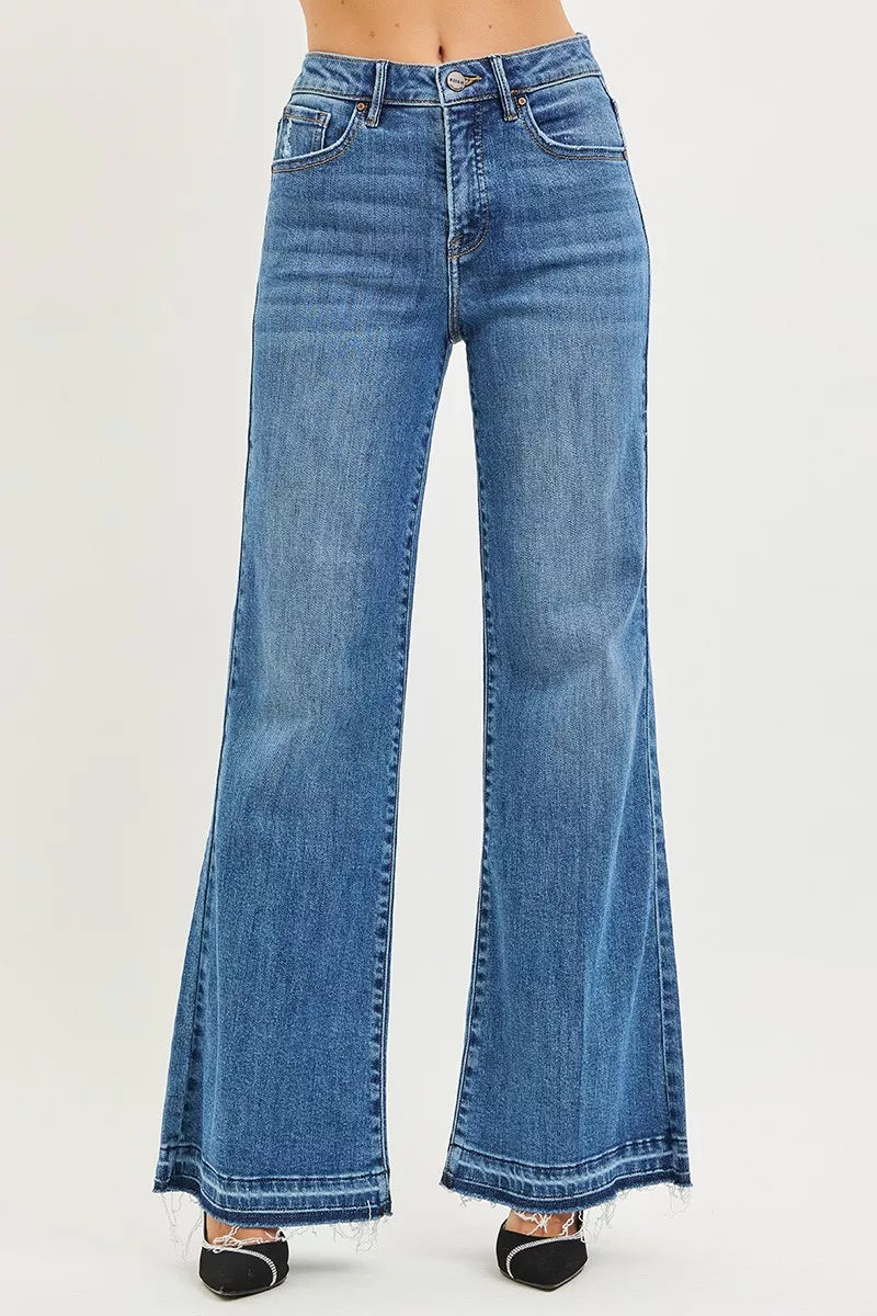 Blue flared jeans on a white background