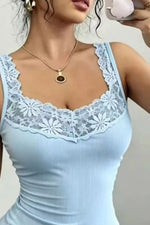 Light blue tank top with lace detailing worn by a person.