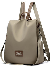 Beige backpack with a visible brand logo on a white background