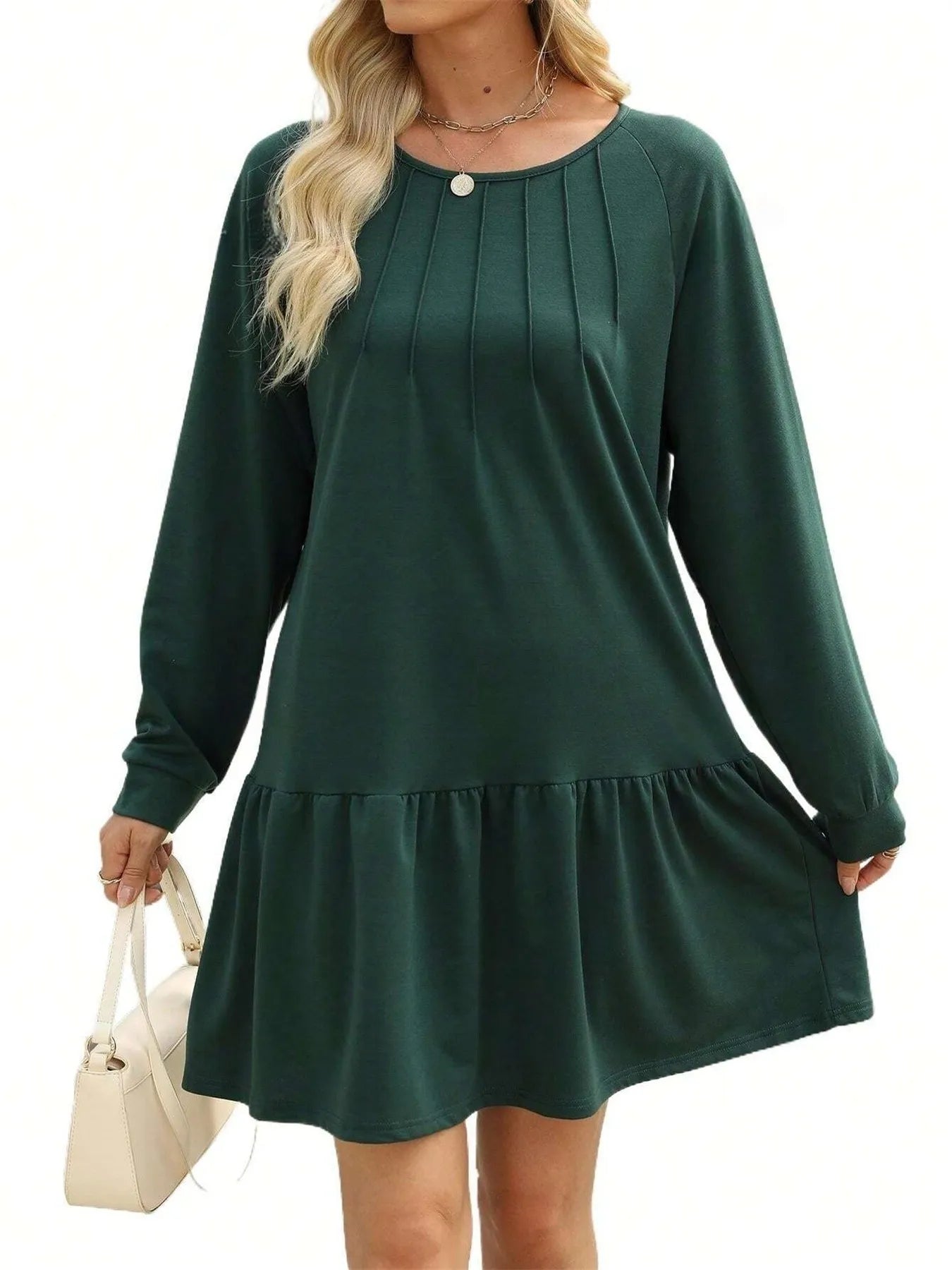Green dress with long sleeves on a white background