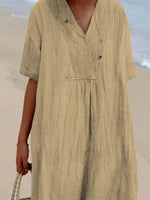 Person wearing a beige dress with a blurred background