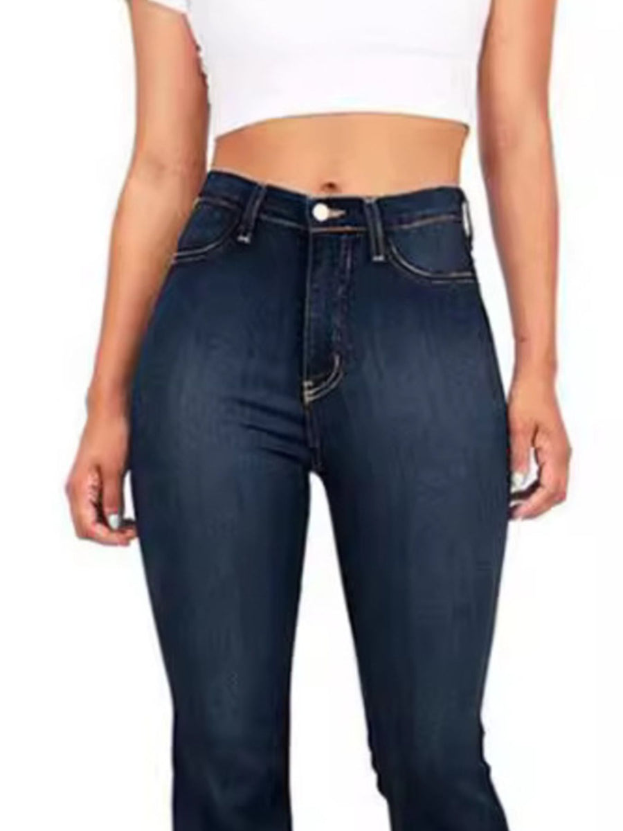 Person wearing dark blue jeans on a white background