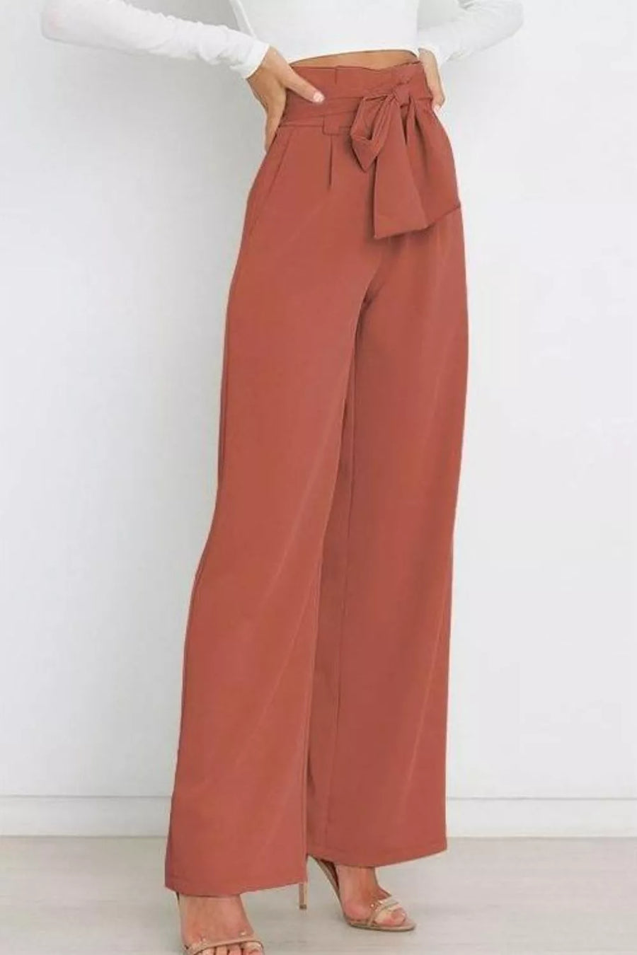 Brown wide-leg pants with a tie waist on a white background