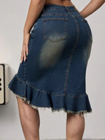 Denim skirt with ruffled hem on a plain background