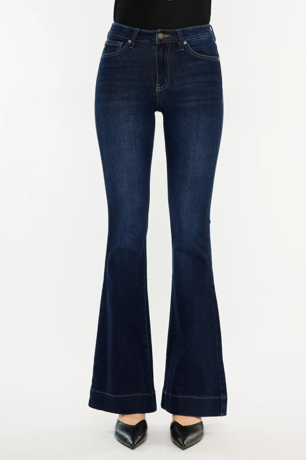 Dark blue flared jeans on a white background