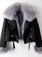 Black denim jacket with gray fur trim on a white background