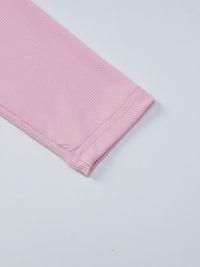 Pink textured fabric on a light gray background