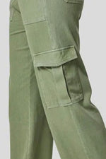 Green cargo pants on a light gray background