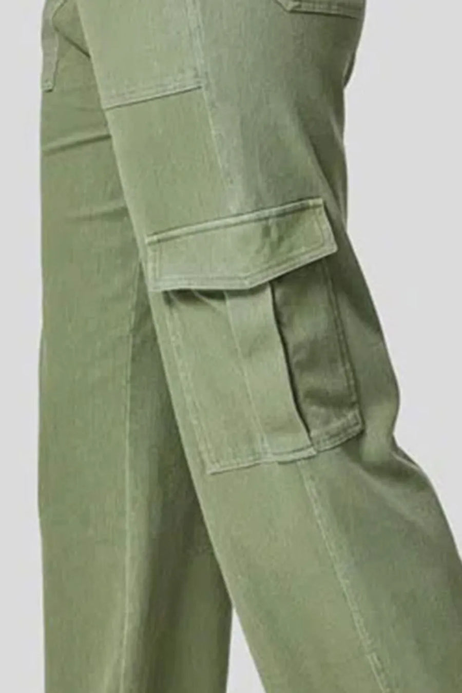 Green cargo pants on a light gray background