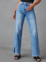 Person wearing blue jeans on a gray background