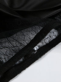 Close-up of black lace fabric with a zipper on a white background