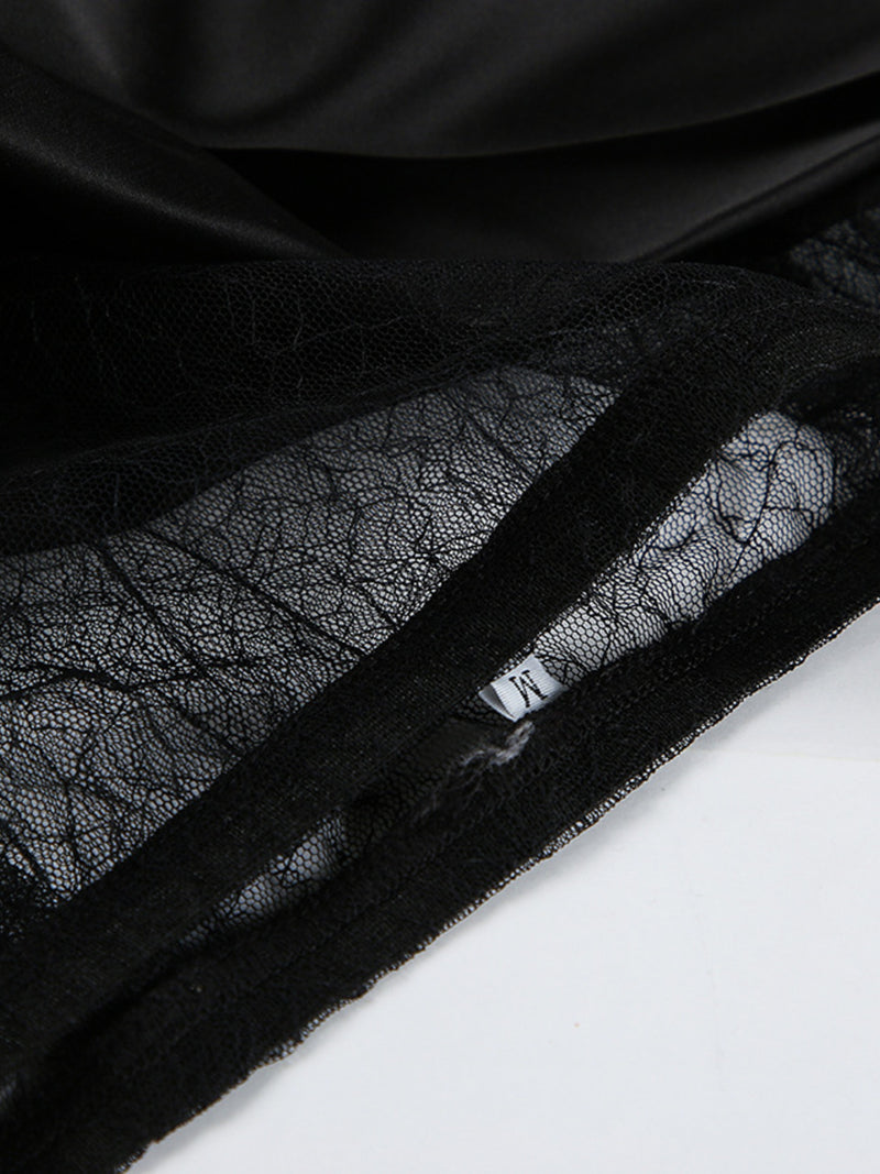 Close-up of black lace fabric with a zipper on a white background