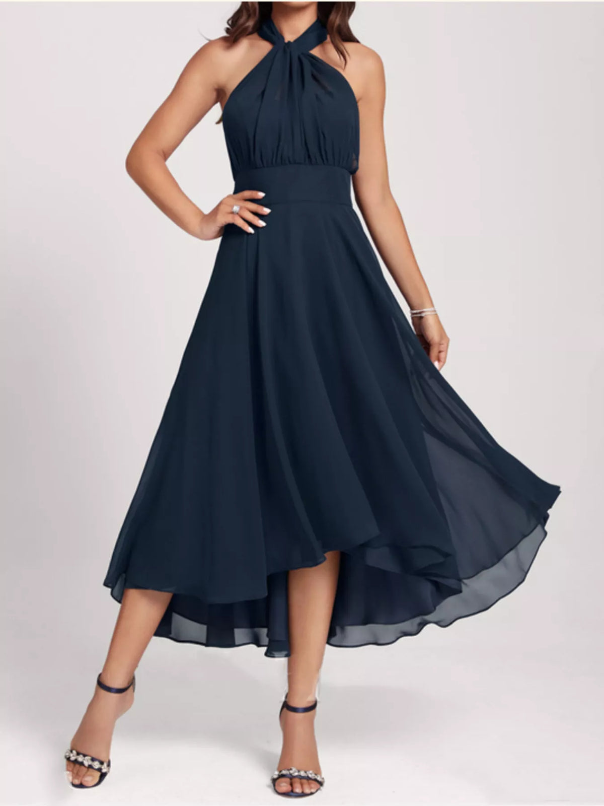 Navy blue halter neck dress on a white background