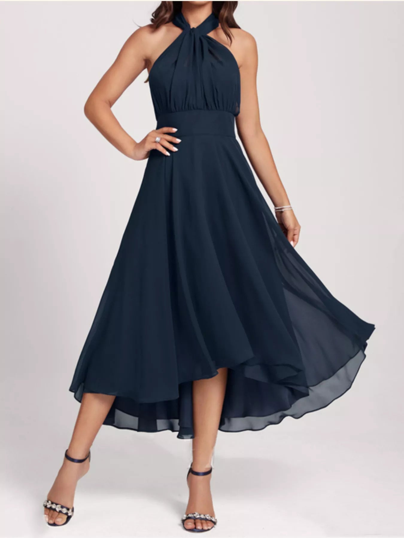Navy blue halter neck dress on a white background