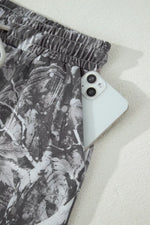 Phone case with leaf pattern on a white surface
