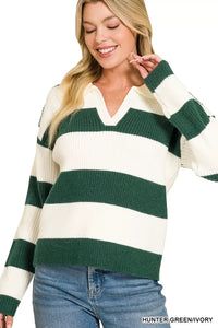 Woman wearing a green and white striped sweater with text 'HUNTER GREEN/Ivory' at the bottom.