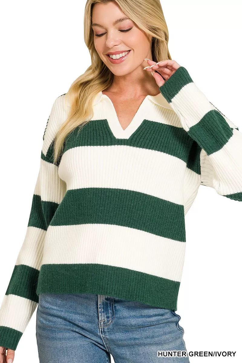 Woman wearing a green and white striped sweater with text 'HUNTER GREEN/Ivory' at the bottom.