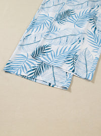 Blue leaf-patterned fabric on a beige background