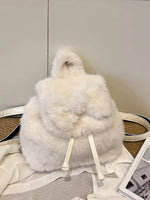 White fur backpack on a neutral background