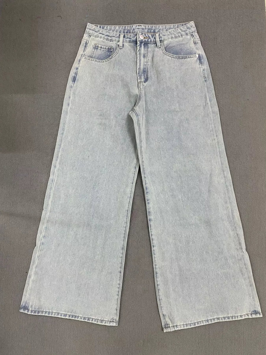 Light blue jeans on a gray background