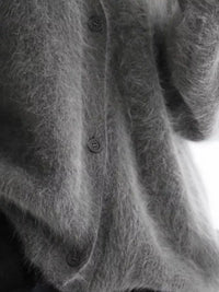 Close-up of a textured gray fabric with buttons
