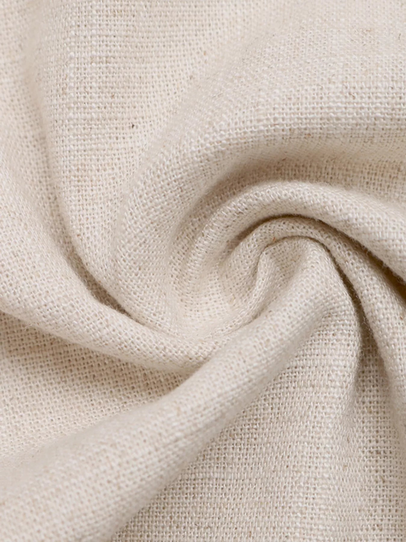 Close-up of beige fabric with a textured pattern