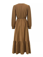 Brown dress with long sleeves and a belt on a white background