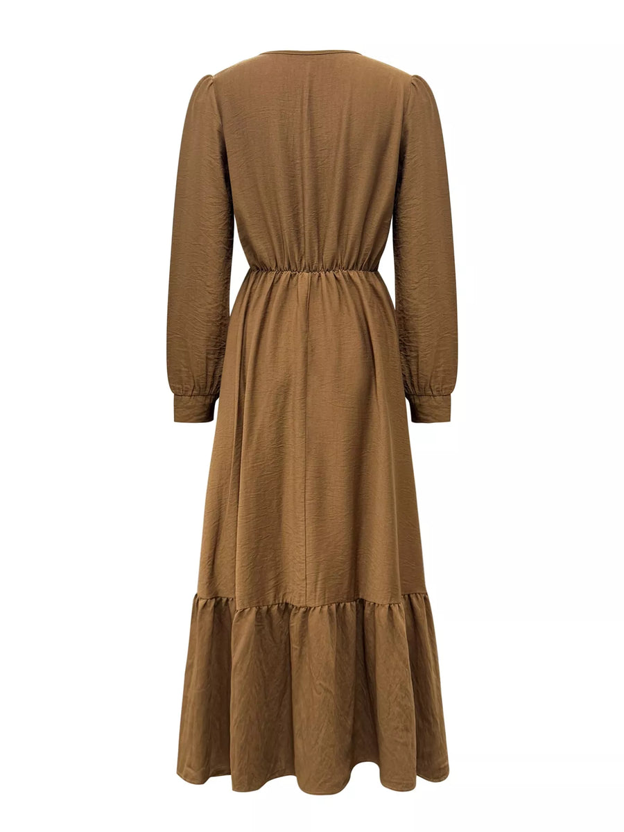 Brown dress with long sleeves and a belt on a white background
