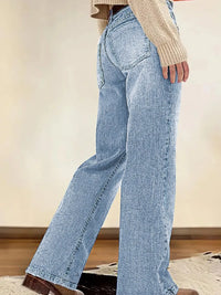 Light blue jeans worn by a person with a neutral background