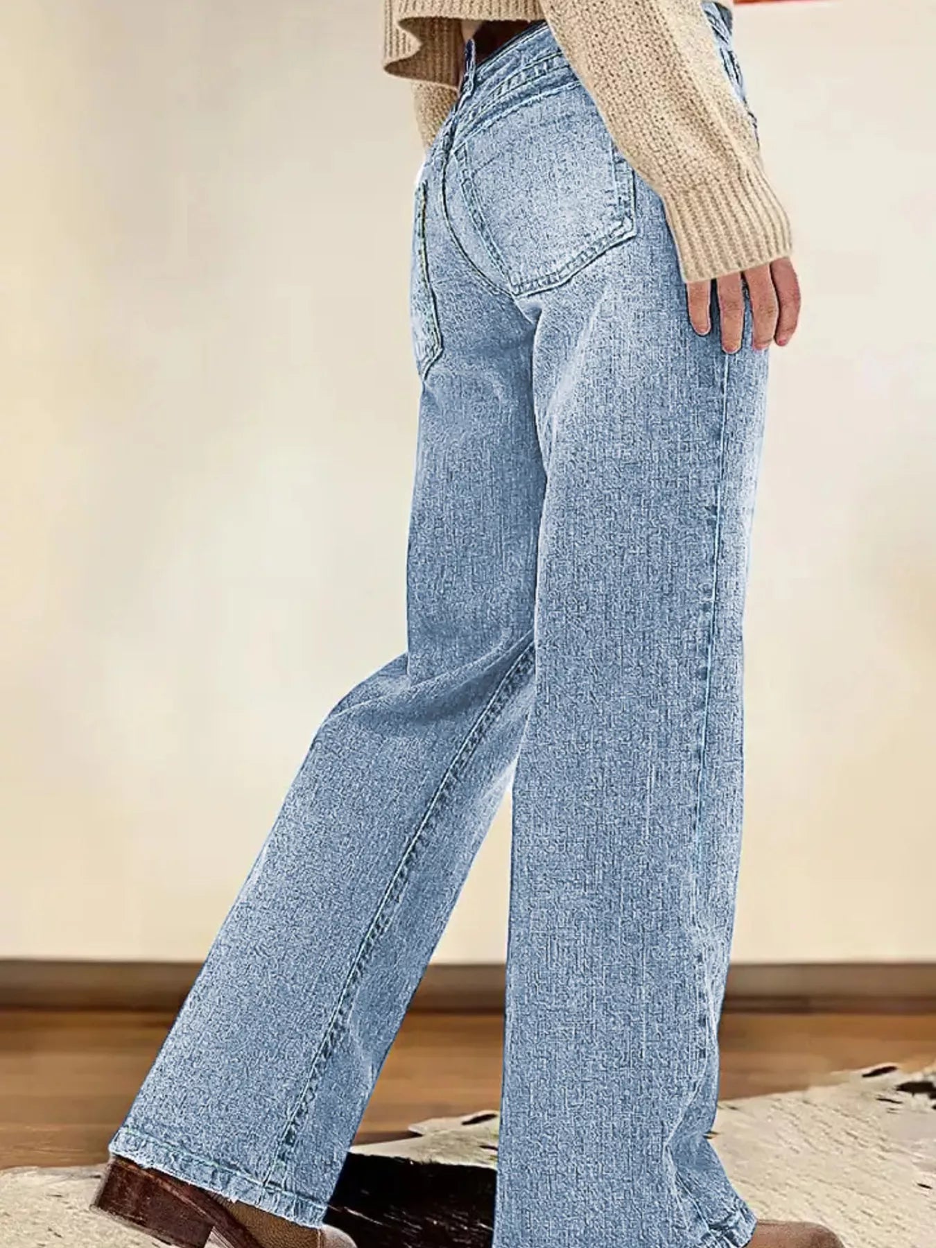 Light blue jeans worn by a person with a neutral background