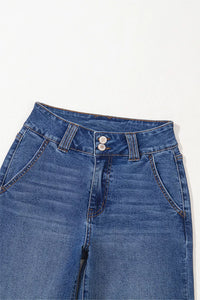 Close-up of blue jeans with a white background