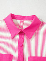 Close-up of a pink and white striped shirt with a bright pink collar on a light gray background