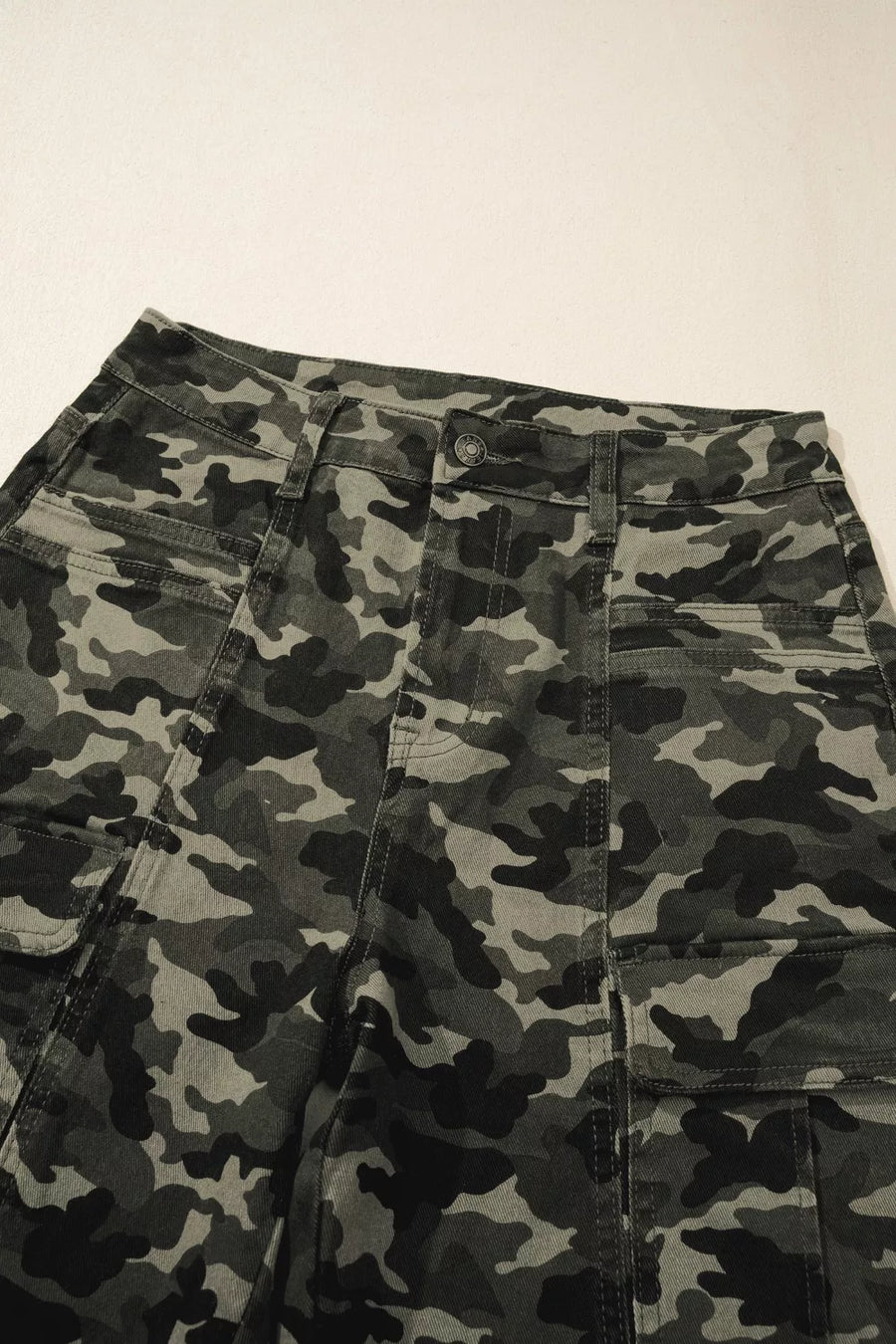 Camouflage pants on a plain background
