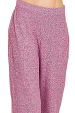 Pink patterned pants on a white background