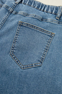 Close-up of a blue denim pocket with stitching details
