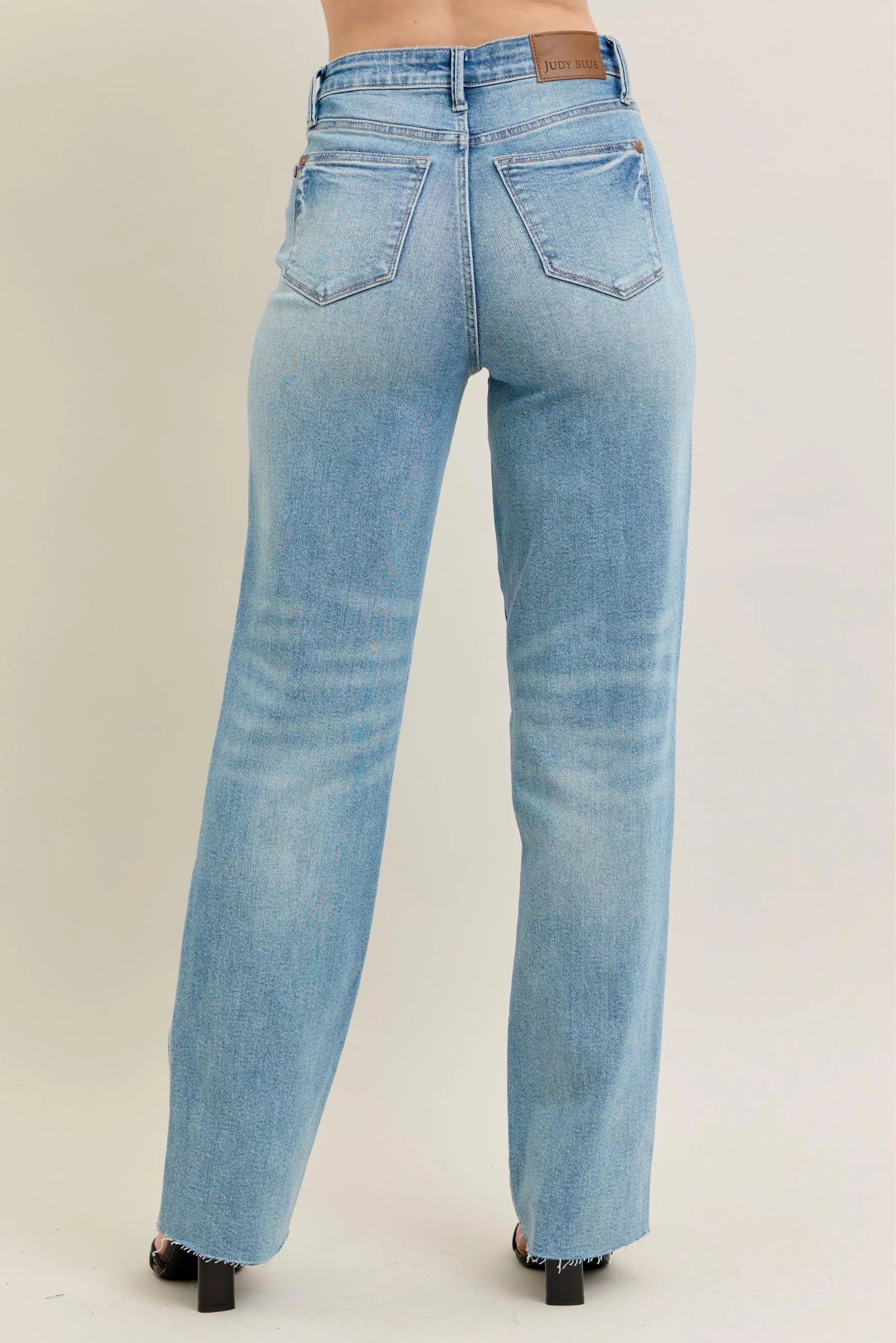 Light blue jeans on a neutral background