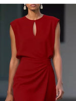 Red dress worn by a model on a dark background