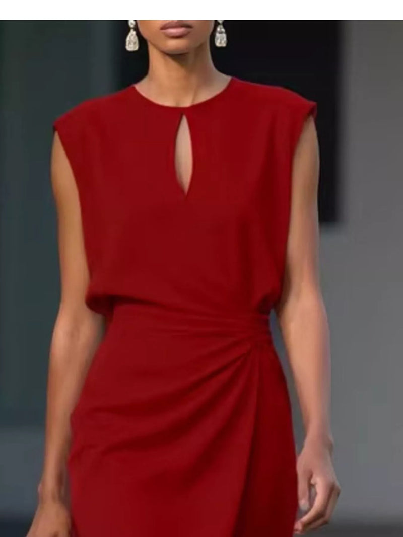 Red dress worn by a model on a dark background
