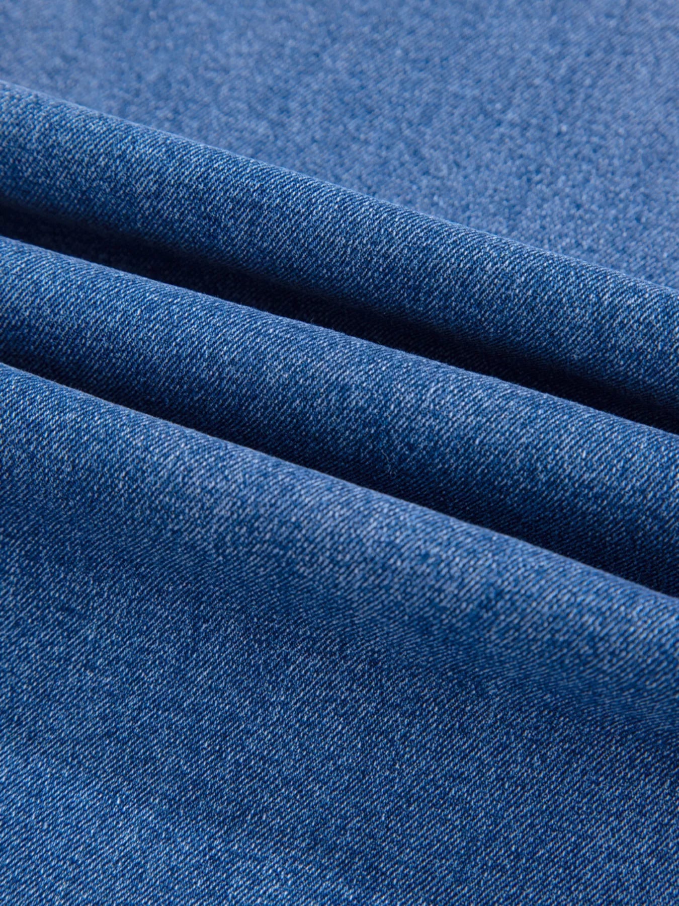 Close-up of blue fabric with a textured pattern