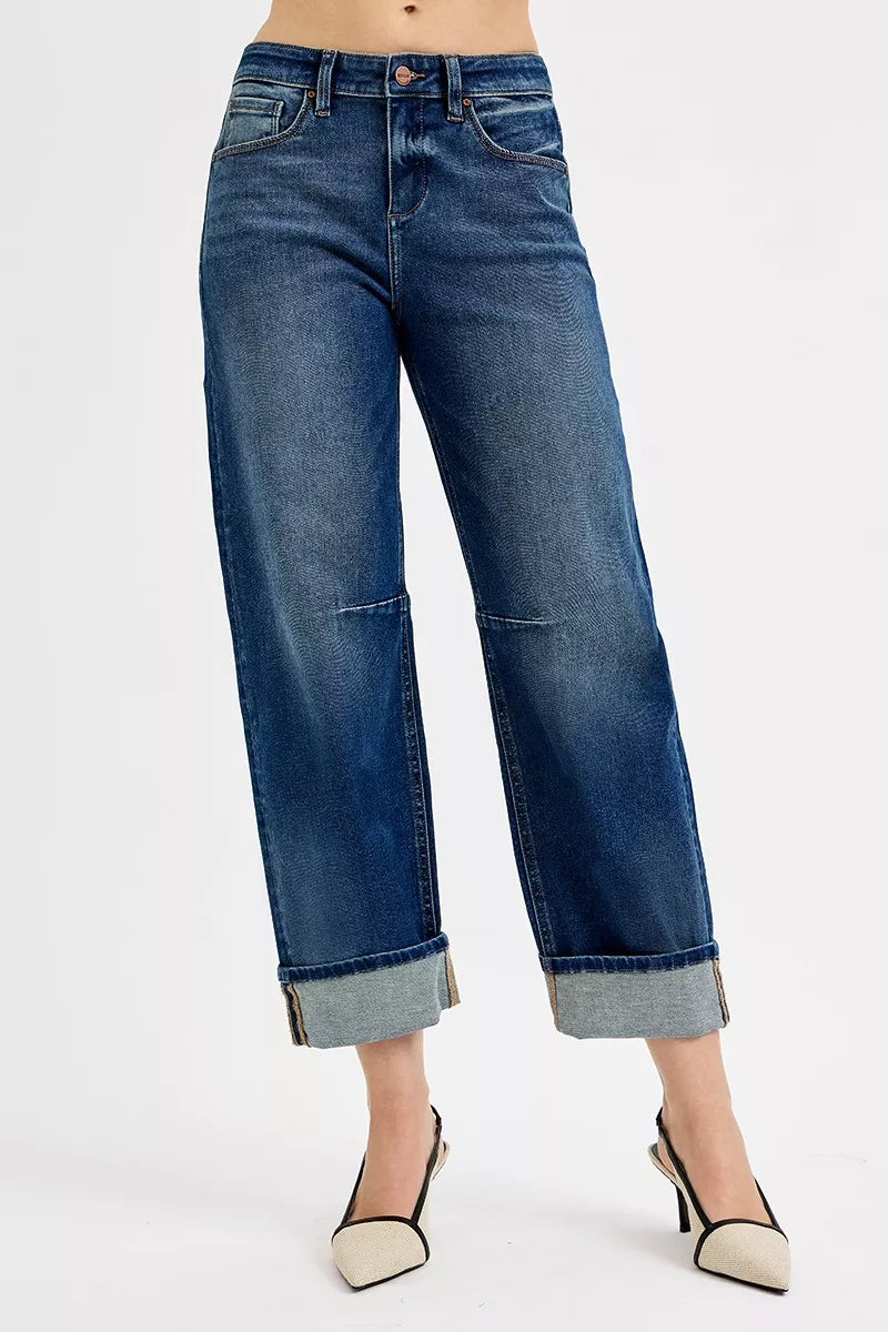 Blue jeans worn by a person on a white background