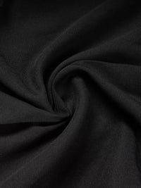 Close-up of black fabric with folds