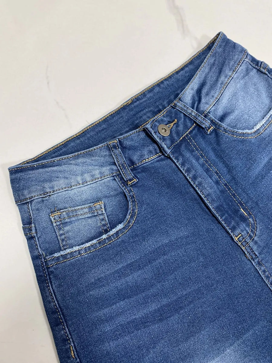 Blue denim shorts on a white background