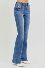 Blue flared jeans on a white background